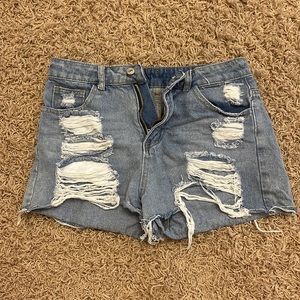 medium wash, mid rise, lots of holes